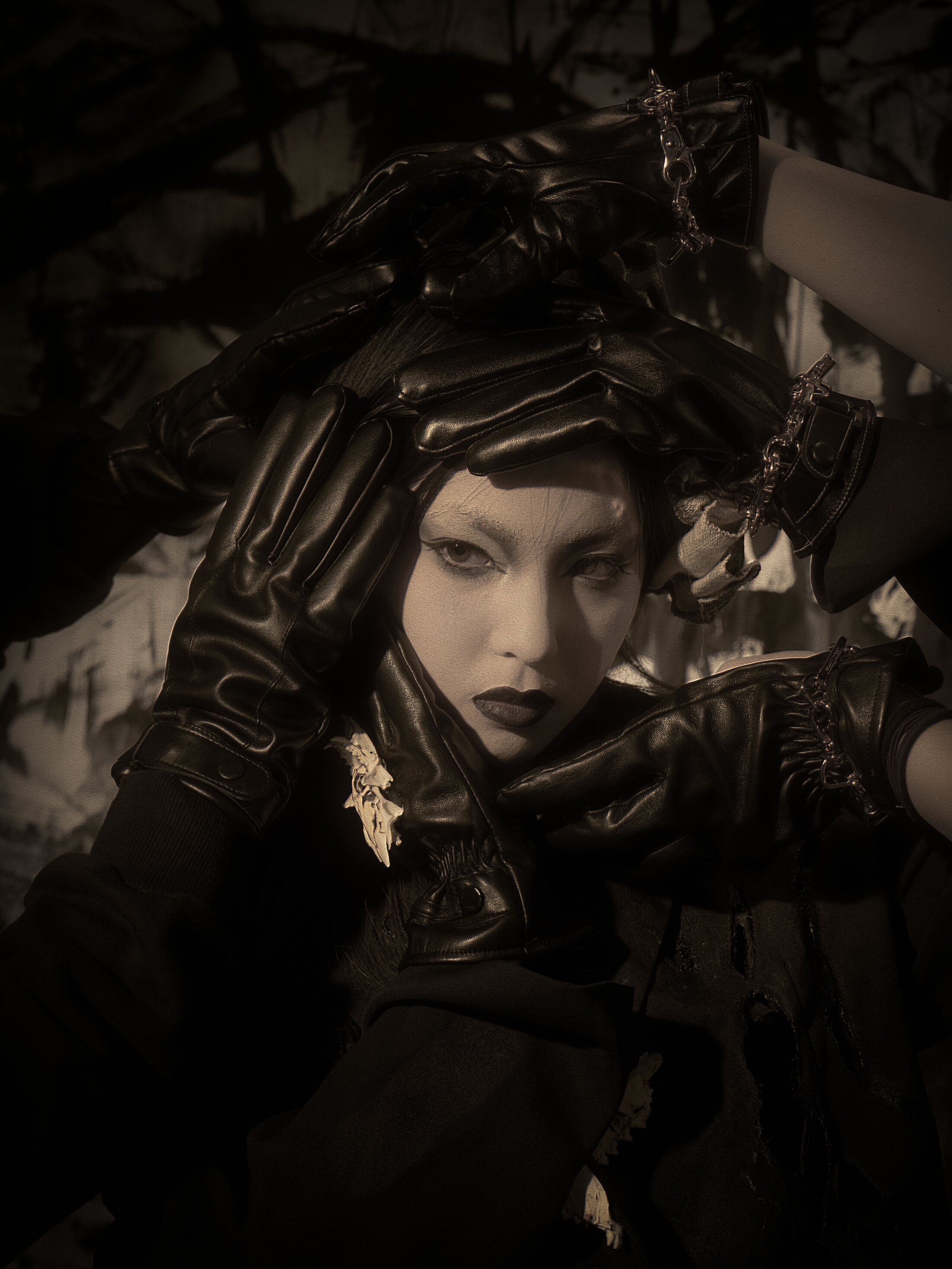 Veil of Absence — a masked figure in black leather gloves framing a face