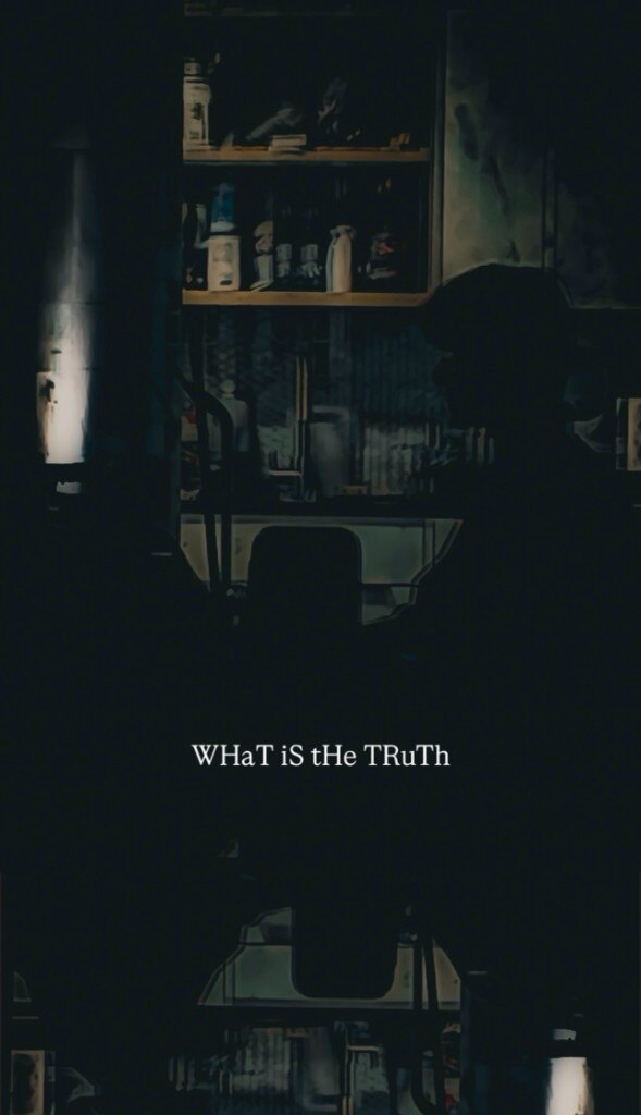 A dark interior, the words What Is the Truth held in the light