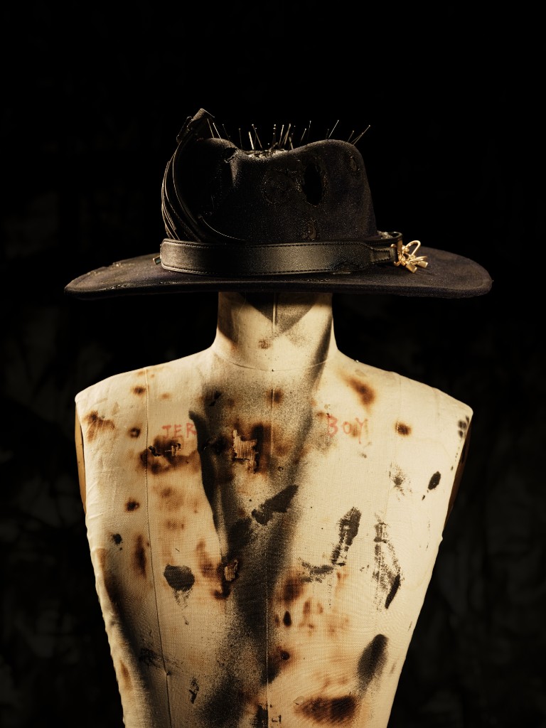 Pileus cocktail — a black hat pierced with pins